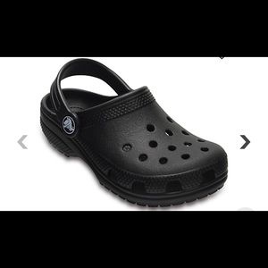 Woman’s black crocs